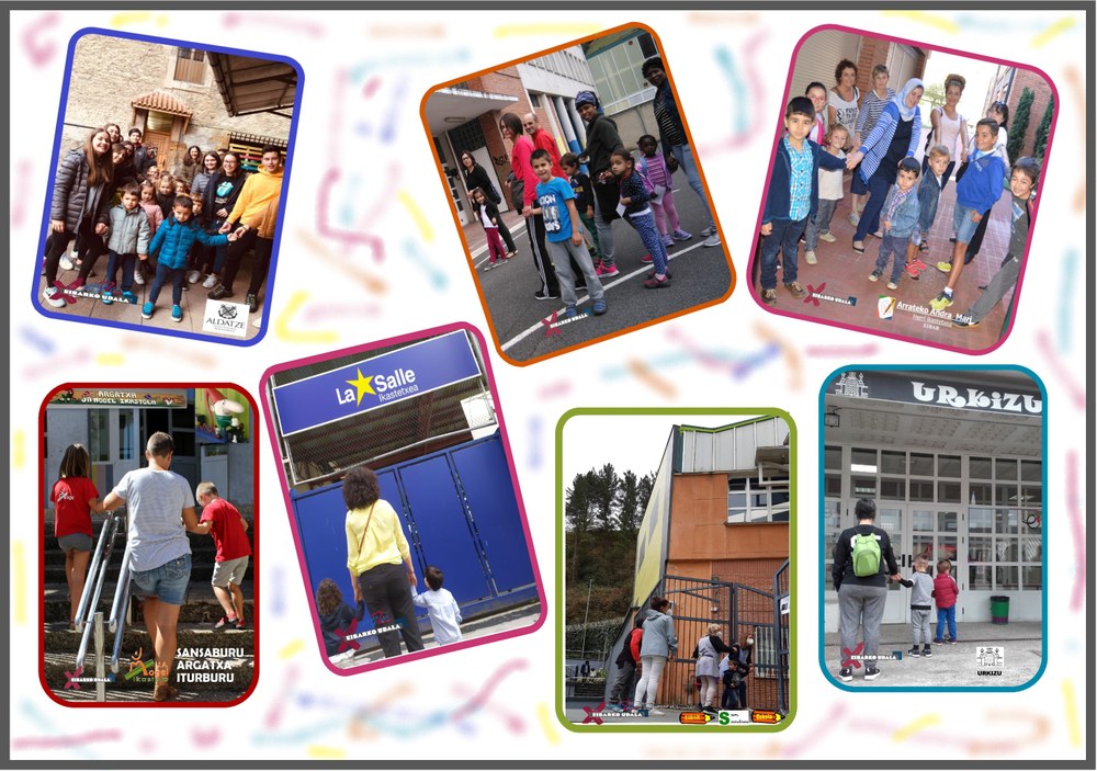 Abierta la inscripción en el programa "Gurasoak ere eskolara" Fotos de niños y niñas con sus madres y padres en la entrada de la escuela.