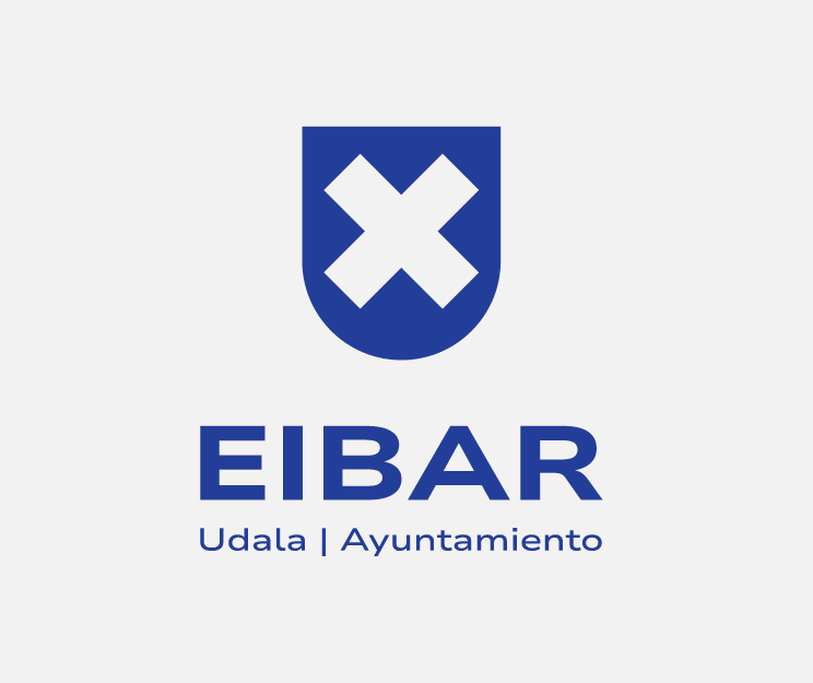 logotipo bertikala urdina hondo txuriarekin